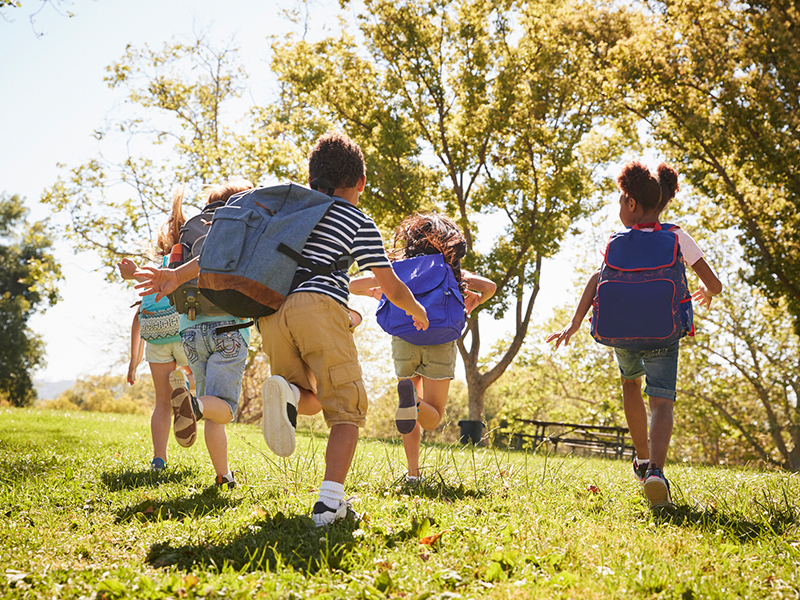 kids running in the fields