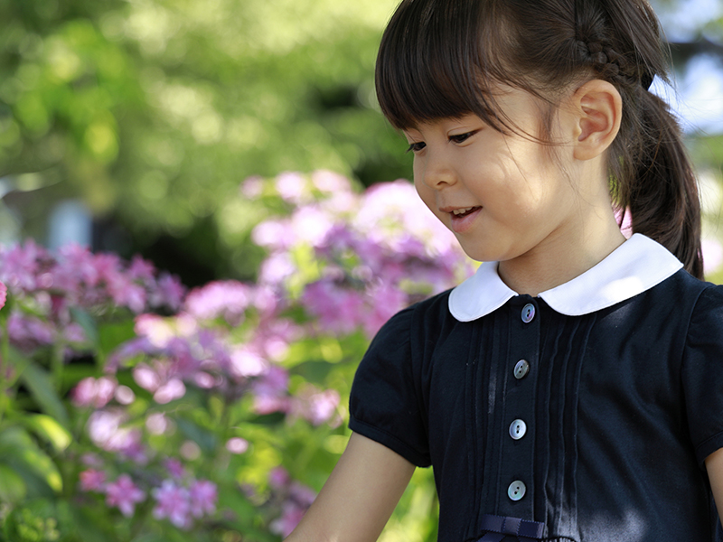 girl picking flowers